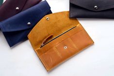 "Wallet. Link to the wallets section - https://www.etsy.com/shop/Pikore?ref=seller-platform-mcnav&section_id=23723064 Looking for a simple and elegant wallet perfectly organizing stuff? A long envelope wallet features slots for credit cards, zip pocket for coins and a section to store bills or even your smartphone. MAIN CHARACTERISTICS: - Size: 🔸 19 x 10 cm ( 7.5 x 4\"); - Flap envelope wallet; - Snap closure; - Zip compartment; - 3 slots for cards.  Custom changes upon request  NOTE: To order a customized item, please send us a CUSTOM ORDER REQUEST. ------------------------------------------------------------- PERSONALIZATION Your initials, text or picture on the item.  How to make your item personalized 1. Purchase the Personalization option by the link: https://www.etsy.com/listing/665 Luxury Leather Envelope Wallet On Chain, Envelope Wallet With Coin Pocket, Long Envelope, Organizing Stuff, Cash Envelope Wallet, Elegant Wallet, Wallet With Coin Pocket, Leather Notebook Cover, Minimalist Leather Wallet