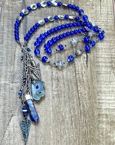 This is a beautiful one of a kind beaded blue stone and crystal charm necklace. Semi precious Stones. Crystal charm. This necklace is made 36 inches long and has an adjustable silver chain. Beaded charm necklace.  Necklaces can be made any size, color or style. Please send me a message if you would like a certain size, color, or style made especially for you!  Thank you for visiting and shopping 27inHeaven! ❤️ Michelle Hoeft Blue Beaded Crystal Necklace, Blue Crystal Beaded Necklaces For Jewelry Making, Blue Crystal Jewelry With Gemstone Beads, Blue Beaded Necklaces With Stones For Jewelry Making, Bohemian Crystal Necklace With Beaded Chain, Handmade Bohemian Sapphire Necklace, Blue Beaded Dangle Necklaces With Natural Stones, Blue Beaded Dangle Crystal Necklace, Blue Beaded Dangle Crystal Necklaces