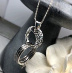 "THE ORIGINAL RING HOLDING PENDANT DESIGNER ON ETSY. This .925 sterling silver Lattice Filigree Circle Sterling Silver Pendant & Ring holder pendant measures aproximately 7/8\" (circle part is 3/4\" or 18mm) . Nickel-Free This pendant will hold a ring up to 5/16\" wide (5mm) x 1/8\" (2mm) thick. Rings larger than that will not fit. When you need to take off your rings, keep your rings close to your heart. Think about how many times a day you might need to remove your ring, only to worry abou Nickel-free Heirloom Jewelry For Anniversary, Heirloom Nickel-free Jewelry For Anniversary, Heirloom Sterling Silver Jewelry For Anniversary, Silver Round Jewelry For Anniversary Gift, Silver Jewelry For Anniversary Gift, Classic Rings With Spring Ring Clasp For Gifts, Sterling Silver Wedding Pendant Rings, Elegant 925 Stamped Jewelry For Anniversary, Silver Oval Jewelry For Anniversary Gift