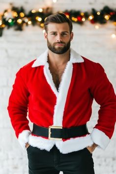 a man in a santa suit standing with his hands on his hips