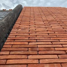 a brick wall with a sky background