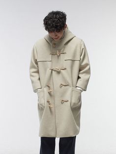 Editor's NotesMalen's classic and trendy duffle coat is made of warm wool blended material. It is designed with a hoodie and buttons on the neckline.- Classic duffle coat- Pocket details- Hooded coat- Wool blended material- Buttons on the neckline Measurements(in.)1/2- Shoulder: 22.04 / 24.40 in.- Chest: 25.98 / 28.34 in.- Sleeve: 20.47 / 22.83 in.- Total length: 39.37 / 41.73 in.Model infoMan - Height: 5'97 Fitting size 2Woman - Height: 5'47 Fitting size 2Composition & Care- 90% Wool, 10% Nylon- Please check the labelDesigner- by malen Hooded Khaki Outerwear With Buttons, Casual Wool Coat With Stand Collar For Winter, Casual Winter Wool Coat With Stand Collar, Classic Hooded Wool Coat, Hooded Wool Outerwear With Pockets, Casual Long Wool Coat, Beige Hooded Outerwear With Buttons, Casual Long Wool Coat For Cold Weather, Casual Hooded Wool Coat With Pockets