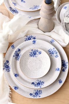 blue and white dinnerware on a wooden table