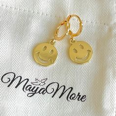 - Smiley Face Earrings - Today is your day to glam with MayaMore Jewelry! This item is nickel-free and lead-free. This item is made of high-quality materials. P R O D U C T D E T A I L S Material: Charm: 14K Gold Filled Hoop: 18K Gold Filled Measurements: Charm Size: 14 mm Hoop Size: 16 mm 💝 Elegant Gift wrap is available and you can leave a gift message. We can also add your personalized notes inside the box on both standard and giftwrap package. 💝 You will receive this product packed neatly Elegant Gift Wrapping, Pretty Ear Piercings, Face Earrings, Funky Earrings, Gold Filled Hoops, Personalized Notes, Happy Face, Smiley Face, Smile Face