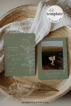 the wedding stationery is displayed on a wooden plate