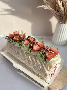 a piece of cake with strawberries on top