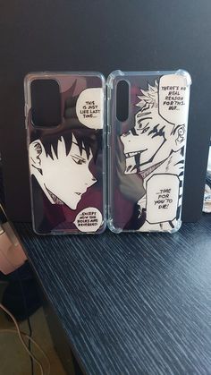 two clear cases sitting on top of a table next to each other with comic characters