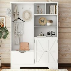 a white bookcase filled with lots of items