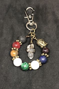 a key chain with charms and beads on it