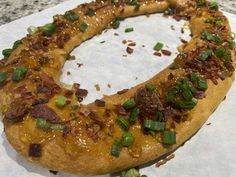 the bread has been cooked and is ready to be eaten with green onions on it