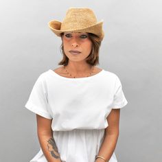 Introducing the Belfry Llina, the ultimate hat for those looking to channel a western, casual style. Made with raffia straw, this packable hat features an adjustable and tieable chinstrap, allowing for versatile wear. FEATURESStyle: Outdoor with Snap-Up BrimMaterial: 100% Raffia Dimensions: 4" Crown, 3" BrimNotes: Brim can be attached to the crown of the hat via snap fasteners on each side. Western Casual, Pork Pie Hat, Packable Hat, Hat Size Chart, Pork Pie, Snap Fasteners, Cloche Hat, Felt Hat, Hat Sizes