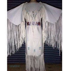 Womens White Colour Handmade Long Wedding Dress Powwow Regalia Leather Dress Native Womens Leather Maxi Native American Womens Coat Dress Features: * 100 % genuine top quality leather. * White color * Lining Material : Polyester * Long Fringes * Stitched work For Your Best Fit: I Need Your Below Sizes -Neck: -Shoulder to shoulder: -Sleeves Length -Chest: **Custom orders after manufactured on demand so return or exchange is not acceptable** -------------------------- DELIVERY DETAIL ------------- Native American Wedding Dress, Pocahontas Birthday, Native Dresses, Buckskin Dress, American Wedding Dress, American Indian Clothing, Fringe Wedding Dress, Native American Wedding, Native American Dress