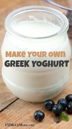 blueberries and yogurt on a wooden table with the words make your own greek yogurt