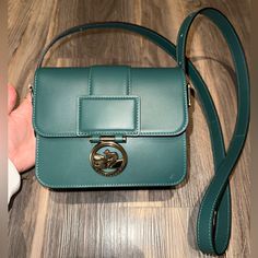 Beautiful Emerald/Forest Green Shoulder Bag With Pale Gold Hardware. Brand New, Never Used, Only Defect Is A Tiny Surface Scratch On The Bottom Right Of The Front Of The Bag (Barely Noticeable!) Retails For $590! Comes With Dust Bag :) Green Rectangular Bag With Turn-lock Closure, Formal Green Bag With Turn-lock Closure, Longchamp Box Trot, Green Shoulder Bag, Emerald Forest, Longchamp Handbags, Longchamp Bags, Pale Gold, Capsule Wardrobe