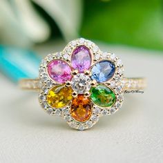 a multicolored flower ring sitting on top of a table