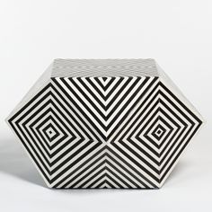 a black and white geometric object on a white background