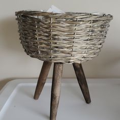 a basket sitting on top of a wooden stool