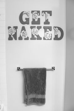 black and white photograph of bathroom with towel rack