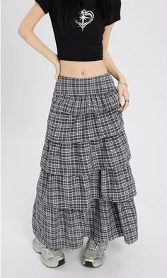 Channel understated chic with this Layered Plaid Maxi Skirt featuring delicate ruffle details.
Crafted from a comfortable blend of mainly cotton, this skirt showcases a multi-layered design that adds a playful twist to the classic plaid pattern. The high-waist cut ensures a flattering silhouette, while the versatile style makes it easy to dress up or down. It's a piece that carries a perfect balance of edgy and professional aesthetics.
Pair this skirt with a tucked-in graphic tee and sneakers fo Chic Tiered Maxi Skirt With Layered Hem, Casual Tiered Pleated Maxi Skirt, Chic Relaxed Tiered Skirt, Chic Tiered Maxi Skirt With Ruffle Hem, Relaxed Tiered Maxi Skirt With Layered Hem, Casual Flowy Maxi Skirt With Layered Hem, Cotton Tiered Voluminous Skirt, Spring Tiered Maxi Skirt With Layered Hem, Ruffled Maxi Skirt For Day Out