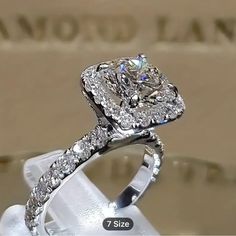 a diamond ring is shown on display with the price tag below it for $ 1, 500