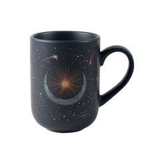 a black coffee mug with an image of the moon and stars on it