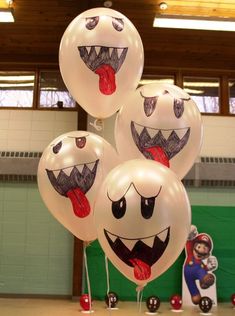 some balloons with faces and mouths on them