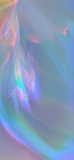 an abstract image of blue, green and pink swirls