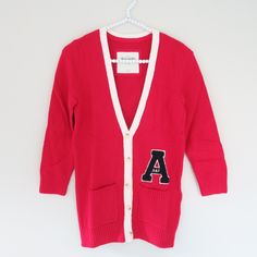 Abercrombie & Fitch - A&F Charlie Red White V Neck A Applique Cardigan Sweater S Brand: Abercrombie & Fitch Color: Red, White Condition: New With Tag Size: S Detail: Supersoft, V-Neck Cardigan With Varsity Letter Applique, Contrast Trim, Logo Engraved Button Closure, Front Patch Pockets, Ribbed Trim, Interior Neck Taping, Classic Fit, Imported 60% Cotton/35% Nylon/5% Angora [Sku: C34] White Cardigan For College In Fall, White Fall Cardigan For College, Red Sweater For College In Fall, Red College Sweater For Fall, Classic Red Cotton Cardigan, Trendy Red V-neck Cardigan, Letter Applique, Fitted Red V-neck Sweater, Red V-neck Cotton Outerwear