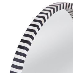 a mirror with black and white stripes on it