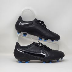 a pair of black and blue soccer shoes