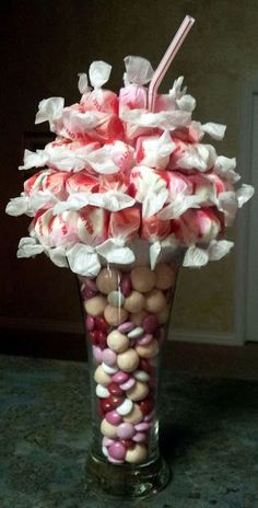 a vase filled with candy and marshmallows