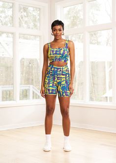 Style #: A2017NTSThe Adamma African Print Sports Bra makes for a stylish take on traditional activewear. The bold printed style can be worn to the gym with our Kimba biker shorts or with a pair of jeans for a night out with friends. Shop all our activewear here. Squared neckline Elastic band with D'IYANU logo on back Medium support Wicking properties 87% nylon/13% spandex​ Designed in the USA, Imported Cold wash. Tumble dry low. Model size: Small | Height 5'11" | Bust 34" | Waist 27" | Hips 38" Trendy Athletic Shorts With Built-in Shorts For Gym, Multicolor Activewear With Built-in Shorts, Summer Athleisure Biker Shorts For Yoga, Medium Support Biker Shorts For Yoga In Summer, Medium Support Biker Shorts For Yoga And Summer, Summer Athleisure Activewear Shorts, Trendy Sleeveless Activewear For Sports, Sporty Multicolor Athletic Shorts With Built-in Shorts, Summer Athleisure Biker Shorts For Workout