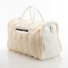 This spacious carrying bag features a fur and leather exterior and designer stylings that make it an impact making addition to any outfit and perfect for either casual or business outings. Product Dimensions (Inches): 21 x 13 x 11 Faux-Leather and Fur Exterior Polyester Lining Luxury Faux Fur Shoulder Bag, Luxury Faux Fur Shoulder Bag With Fur Lining, Luxury Tote Bag For Winter, Luxury Travel Bags For Winter, Luxury Winter Travel Shoulder Bag, Luxury Bags With Faux Fur Lining For Winter, Elegant Rectangular Faux Fur Bag, Luxury Faux Fur Shoulder Bag For Everyday Use, Chic Winter Bags For On-the-go