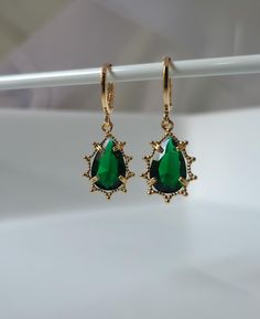 Emerald Green Crystal Teardrop Jewel Huggie Hoop Earrings,  Gold Plated Earrings, Vintage Style Earrings, Victorian Earrings Product specifications: * Material: 14K Gold Plated Brass * Size Each charm measures 1.2 cm x 0.8cm Earring Options: * 8mm inner diameter hoops * 10mm inner diameter hoops * 1.8cm drop hooks Packaging and Gifts: * All pieces of jewellery are sent in a mesh jewellery pouch with a thank you card.  Shipping: * All Australian orders will be shipped out within 1 - 3 days by sta Elegant Hoop Earrings For May Birthstone, Gold Teardrop Earrings With Emerald, Pierced Teardrop Earrings With May Birthstone, Elegant Hypoallergenic May Birthstone Hoop Earrings, Pear-shaped May Birthstone Earrings For Gifts, Teardrop Hoop Earrings For May Birthstone, May Birthstone Drop Hoop Earrings For Pierced Ears, Tarnish Resistant Pear-shaped Earrings Gift, Teardrop Hoop Earrings As May Birthstone Gift