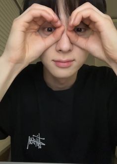 a person with their hands on their eyes