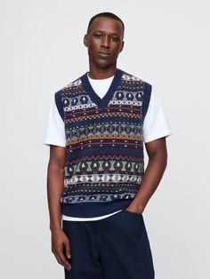 Supersoft cotton-blend sweater vest.  V-neck.  Sleeveless.  Banded hem.  Allover Fair Isle.  Fit: Classic.  A straight & easy fit.  Hits at the hip.  Models are 6′1″–6′2″ 185 cm–188 cm) with a 31″ 79 cm) waist & 32–33″ 81 cm–84 cm) inseam & are wearing Gap Sweater Vest Outfit, Christmas Sweater Vest, Plush Yarn, Vest Men, Christmas Sweater Men, Everyday Luxury, Style Inspiration Winter, List Ideas, Fair Isle Sweater