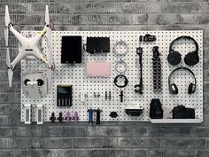 High density fiberboard is a cost effective and decorative pegboard storage and organization solution for garage, warehouse, and tool storage area. Hanging this sturdy pegboard on a wall maximizes usable storage space on walls for easy organization and accessibility. Use Triton DuraHook 70000 series locking pegboard hooks along with the high density fiberboard pegboards to solve any storage challenges. Unlike many pegboards that are constructed with layers of glued cardboard, these boards are wood construction and will not dry out and fray. Clean up the clutter and use these pegboards to get your tool storage areas organized while also keeping tools readily accessible and available. This set of 2 pegboards includes mounting hardware making this a wall-ready storage option. Triton Products Black Pegboard, White Pegboard, Pegboard Bins, Hardware Organizer, Garage Warehouse, Garage Hooks, Pegboard Storage, Pegboard Organization, Pegboard Accessories