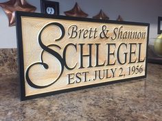 a wooden sign that says breit & shannon schlegel est july 2, 1956