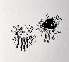 an ink drawing of two jellyfishs with stars and bubbles on the bottom one is black and white