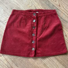 Adorable For Fall With Boots And A Sweater. Never Worn - No Signs Of Wear. 100% Cotton Red Cotton Skirt For Winter, Casual Burgundy Skirt For Fall, Fall Corduroy Mini Skirt With Lining, Trendy Red Corduroy Bottoms, Casual Burgundy Mini Skirt, Fall Corduroy Mini Skirt With Buttons, Red Courderoy Skirt, Vintage Corduroy Skirt, Orange Retro Mini Skirt