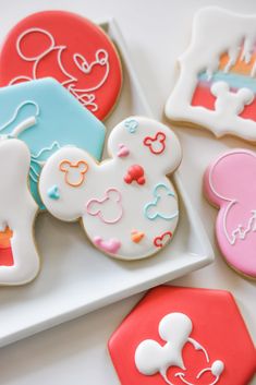 mickey mouse cookies are on a plate