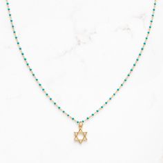 "Dainty Star of David necklace on sterling and gold plated, enamel beaded chain.  Adjustable 16-18\"	in stock	45.00 USD	"	4.00 USD	Jewelry > Necklaces > Charm Necklaces
"	top_seller_high	false	https://www.etsy.com/listing/1584979972/star-of-david-magen-david-necklace-for	adult	etsy://listing/1584979972?ref=applinks_android	stitchandstonedesign	Black	new	en-US	"	false	unisex	0.67	Apparel & Accessories > Jewelry > Necklaces	https://i.etsystatic.com/6649757/r/il/b16bbe/5451198694/il_fullxfull.54511 Star-shaped Beaded Chain Necklace For Gift, Gold Necklaces With Star Charm And Round Beads, Gold Necklace With Star Charm And Round Beads, Star-shaped Jewelry With Beaded Chain For Gifts, Star-shaped Beaded Necklace For Gift, Magen David Necklace, Star Of David Necklace, Necklace Top, Enamel Beads