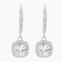 Step into elegance with our exquisite Sterling Silver Cushion Cut Leverback Earrings, featuring a mesmerizing cushion cut clear CZ center stone, surrounded by a halo of sparkling clear cubic zirconia stones. The cushion cut style adds a touch of sophistication and timeless beauty to these earrings, and the secure Leverback closure ensures a comfortable fit. Perfect for any occasion, these earrings will make a statement and elevate your style to the next level. Elegant Cushion Cut Cubic Zirconia Earrings, Square Cut Cubic Zirconia Earrings With Diamond Accents, Cushion Cut Diamond Earrings For Wedding, Wedding Cushion Cut Diamond Earrings, Square Cut Cubic Zirconia Earrings For Wedding, Square Cut Cubic Zirconia Wedding Earrings, Cushion Cut Diamond Accent Earrings For Wedding, Cushion Cut Diamond Accent Wedding Earrings, Elegant Cushion Cut Diamond Earrings For Wedding