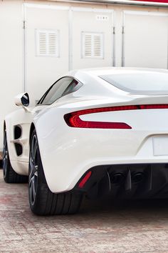 the rear end of a white sports car