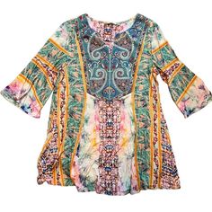 a women's top with colorful patterns on the front and back, in multicolors