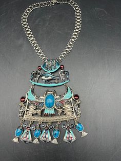 "Made in the 1970's and signed Diorios, this is a STATEMENT Necklace! It Features the Scarab Eye of Horus along with multiple other Egyptian pieces. The necklace fits more like a choker necklace with the HUGE pendant hanging down. Each side of the Book Chain is 7.5\" long. The Pendant is 6\" x 4.25\". One slip ring has been replaced, otherwise it is all original." Vintage Blue Ceremonial Jewelry, Vintage Enamel Necklace With Large Pendant, Vintage Large Pendant Enamel Jewelry, Vintage Enamel Jewelry With Large Pendant, Bohemian Hallmarked Collectible Jewelry, Unique Medallion Necklaces For Collectors, Egyptian Revival, Eye Of Horus, Necklace Silver