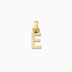 Personalize a charm bracelet, charm necklace, or charm huggie earrings with our Letter Charm. Coming in every letter, this gold charm is perfect for adding initials or a special message to your look. Want a letter charm that has a little more sparkle? Get our pavé version to really stand out. Need more charms or charm bases for your collection? Build Your Own Charm Jewelry now and get all the charm necklace inspo you need right here. Minimalist Everyday Pendant Charms, Dainty Everyday Charms With Initial Pendant, Dainty Everyday Initial Pendant Charms, Personalized Everyday Dangle Charms, Personalized Dangle Charms For Everyday, Classic Charms For Everyday, Minimalist Hypoallergenic Charms For Everyday, Minimalist Hypoallergenic Everyday Charms, Elegant Everyday Logo Charm