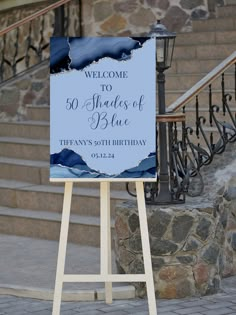 a welcome sign stands in front of some steps