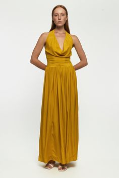 DESCRIPTION The Cowl Neck Maxi dress has a Grecian-inspired silhouette that makes such an elegant choice for any special event. It's made from the softest rayon that artfully gathers around the neck for a hit of drama. The back is elasticised for all-night comfort, and pockets either side bring functionality to form. * Prints and colours may vary slightly due to the handmade nature of each piece. Color: Citrus Chaos DETAILS & CARE INSTRUCTIONS 100% Sustainable Rayon Gentle cold hand wash separat Sleeveless Pre-draped Dress With Ruched Back, Silk Maxi Dress With Pleated Back For Cocktail, Fitted Draped Dress With Gathered Neckline, Silk A-line Dress With Ruched Detail, Sleeveless Dress With Gathered Neckline For Party, Silk Maxi Dress With Ruched Bodice For Cocktail, Spring Gala Dress With Ruched Back, Pre-draped Pleated Silk Dress, Pleated Draped Gala Dress