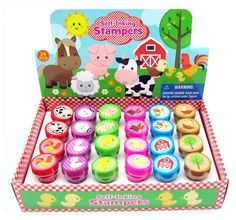 an assortment of farm animals and candles in a box